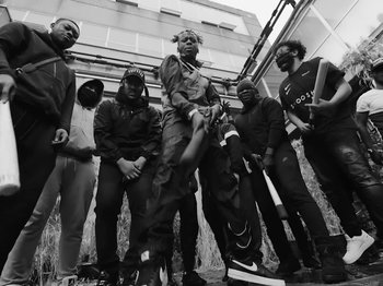 Movie still from “Pa Salieu feat. BackRoad Gee - My Family” (2020), directed by Femi Ladi – Medium shot, Low angle