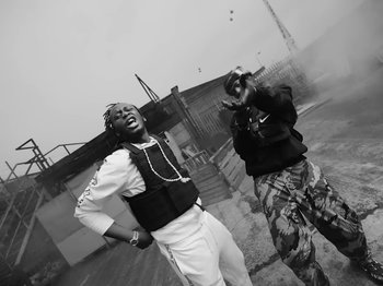 Movie still from “Pa Salieu feat. BackRoad Gee - My Family” (2020), directed by Femi Ladi – Medium shot, Low angle