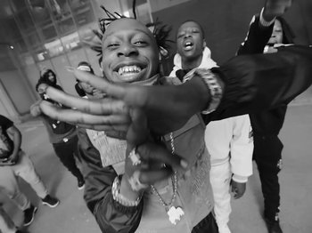 Movie still from “Pa Salieu feat. BackRoad Gee - My Family” (2020), directed by Femi Ladi – Medium shot, Low angle