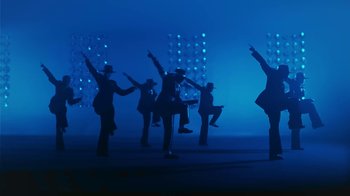 Movie still from “Victoria Monét - Alright” (2024), directed by Dave Meyers – Wide shot, Low angle