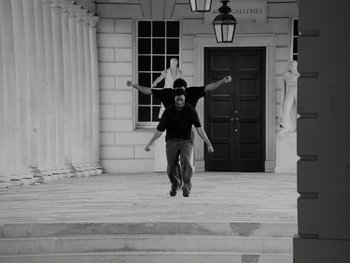 Movie still from “Botis Seva - Santo” (2022), directed by Freddie Leyden – Wide shot, Low angle