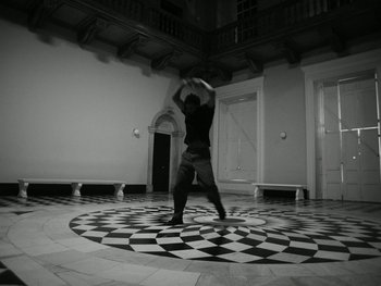 Movie still from “Botis Seva - Santo” (2022), directed by Freddie Leyden – Wide shot, High angle