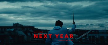 Movie still from “aexattack - Next Year” (2021), directed by Jetski – Extreme Wide shot, Over the shoulder angle