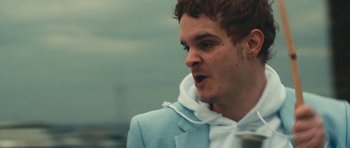 Movie still from “aexattack - Next Year” (2021), directed by Jetski – Close Up shot, Low angle