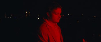 Movie still from “aexattack - Next Year” (2021), directed by Jetski – Close Up shot, Low angle