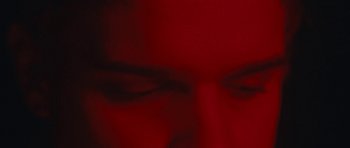 Movie still from “aexattack - Next Year” (2021), directed by Jetski – Extreme Close Up shot, Overhead angle