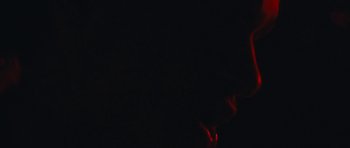 Movie still from “aexattack - Next Year” (2021), directed by Jetski – Extreme Close Up shot, Low angle