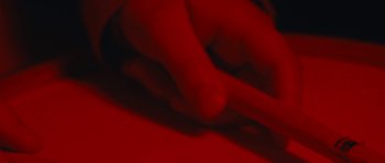 Movie still from “aexattack - Next Year” (2021), directed by Jetski – Extreme Close Up shot, Overhead angle