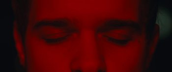 Movie still from “aexattack - Next Year” (2021), directed by Jetski – Extreme Close Up shot, Overhead angle