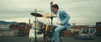 Movie still from “aexattack - Next Year” (2021), directed by Jetski – Medium shot, Low angle