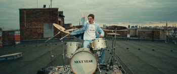 Movie still from “aexattack - Next Year” (2021), directed by Jetski – Medium shot, Low angle