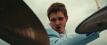 Movie still from “aexattack - Next Year” (2021), directed by Jetski – Close Up shot, Low angle