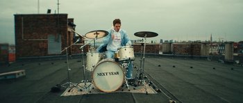 Movie still from “aexattack - Next Year” (2021), directed by Jetski – Wide shot, Low angle