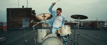 Movie still from “aexattack - Next Year” (2021), directed by Jetski – Medium shot, Low angle