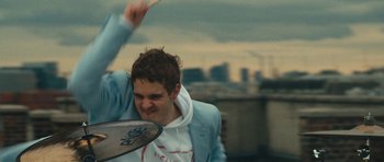 Movie still from “aexattack - Next Year” (2021), directed by Jetski – Medium shot, Low angle