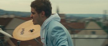 Movie still from “aexattack - Next Year” (2021), directed by Jetski – Close Up shot, Low angle