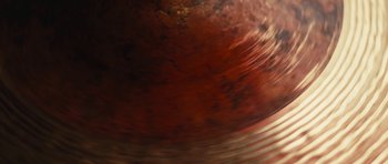 Movie still from “aexattack - Next Year” (2021), directed by Jetski – Extreme Close Up shot, Overhead angle