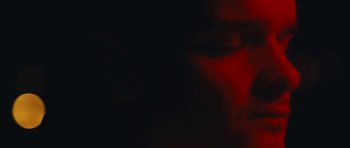 Movie still from “aexattack - Next Year” (2021), directed by Jetski – Extreme Close Up shot, Low angle