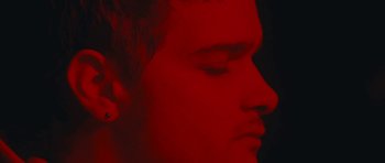 Movie still from “aexattack - Next Year” (2021), directed by Jetski – Extreme Close Up shot, High angle