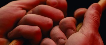 Movie still from “aexattack - Next Year” (2021), directed by Jetski – Extreme Close Up shot, Overhead angle