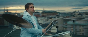 Movie still from “aexattack - Next Year” (2021), directed by Jetski – Medium shot, Low angle