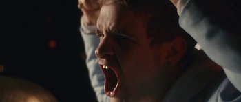 Movie still from “aexattack - Next Year” (2021), directed by Jetski – Extreme Close Up shot, Low angle