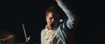 Movie still from “aexattack - Next Year” (2021), directed by Jetski – Medium shot, Low angle