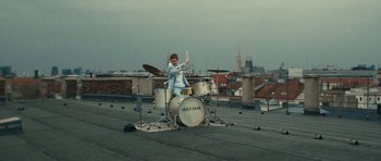 Movie still from “aexattack - Next Year” (2021), directed by Jetski – Wide shot, Low angle