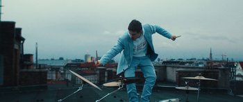 Movie still from “aexattack - Next Year” (2021), directed by Jetski – Medium shot, Low angle