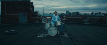 Movie still from “aexattack - Next Year” (2021), directed by Jetski – Wide shot, Low angle