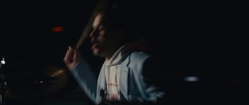 Movie still from “aexattack - Next Year” (2021), directed by Jetski – Medium shot, Low angle