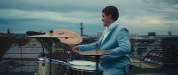 Movie still from “aexattack - Next Year” (2021), directed by Jetski – Medium shot, Low angle