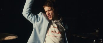 Movie still from “aexattack - Next Year” (2021), directed by Jetski – Medium shot, Low angle