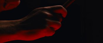 Movie still from “aexattack - Next Year” (2021), directed by Jetski – Extreme Close Up shot, Overhead angle