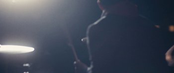 Movie still from “aexattack - Next Year” (2021), directed by Jetski – Extreme Close Up shot, Low angle