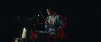 Movie still from “aexattack - Next Year” (2021), directed by Jetski – Medium shot, Low angle