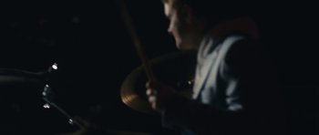 Movie still from “aexattack - Next Year” (2021), directed by Jetski – Extreme Close Up shot, Over the shoulder angle