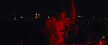 Movie still from “aexattack - Next Year” (2021), directed by Jetski – Medium shot, Low angle