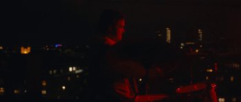 Movie still from “aexattack - Next Year” (2021), directed by Jetski – Medium shot, Low angle