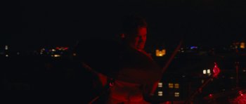 Movie still from “aexattack - Next Year” (2021), directed by Jetski – Medium shot, Low angle