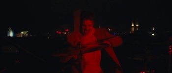 Movie still from “aexattack - Next Year” (2021), directed by Jetski – Medium shot, Low angle