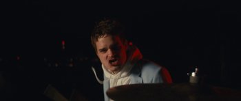 Movie still from “aexattack - Next Year” (2021), directed by Jetski – Close Up shot, Low angle