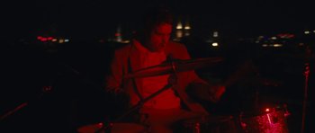 Movie still from “aexattack - Next Year” (2021), directed by Jetski – Medium shot, Low angle