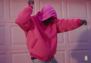 Movie still from “Lil Yachty - TESLA” (2023), directed by Cole Bennett – Medium shot, Low angle