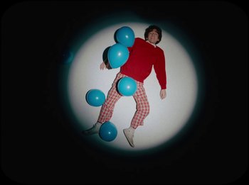 Movie still from “French Cassettes - White Noise” (2024), directed by Syra McCarthy – Wide shot, Overhead angle