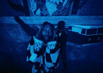 Movie still from “Metro Boomin & Future - Superhero (Heroes & Villains)” (2022) – Medium shot, Low angle