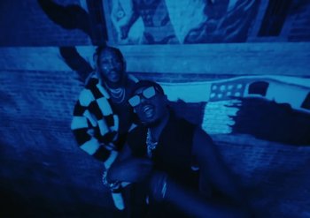 Movie still from “Metro Boomin & Future - Superhero (Heroes & Villains)” (2022) – Medium shot, Low angle