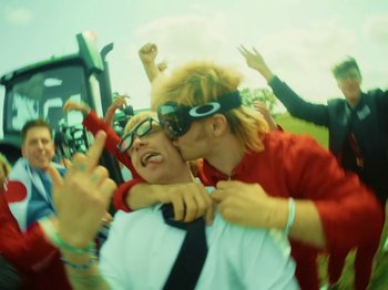 Movie still from “Joost, Ski Aggu & Otto Waalkes - Friesenjung” (2023), directed by Joost Klein – Close Up shot, Over the shoulder angle