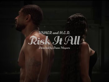 Movie still from “USHER, H.E.R. - Risk It All” (2024), directed by Dave Meyers – Extreme Wide shot, Overhead angle