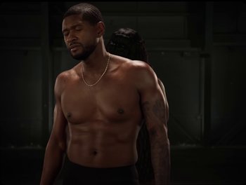 Movie still from “USHER, H.E.R. - Risk It All” (2024), directed by Dave Meyers – Medium shot, Over the shoulder angle